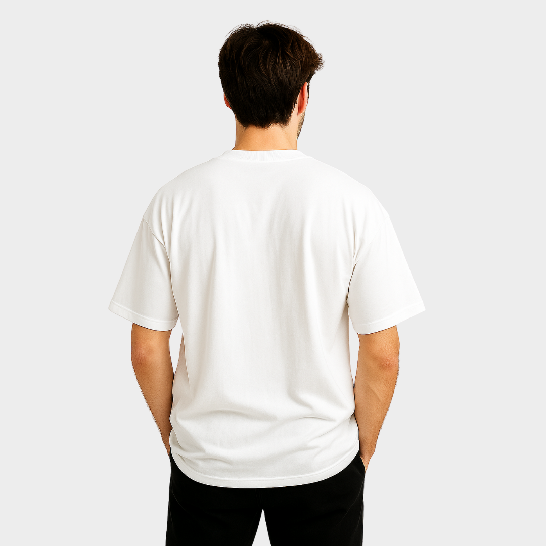 Person wearing a plain white t-shirt on a light gray background